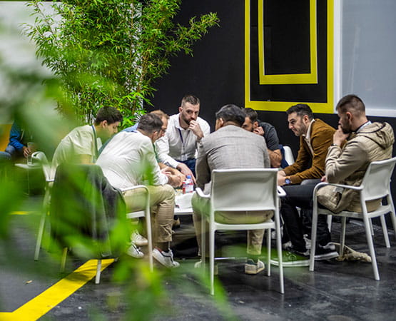 8 men around a table