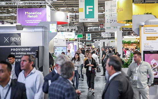 Visitors in front of the Monetico retail stand